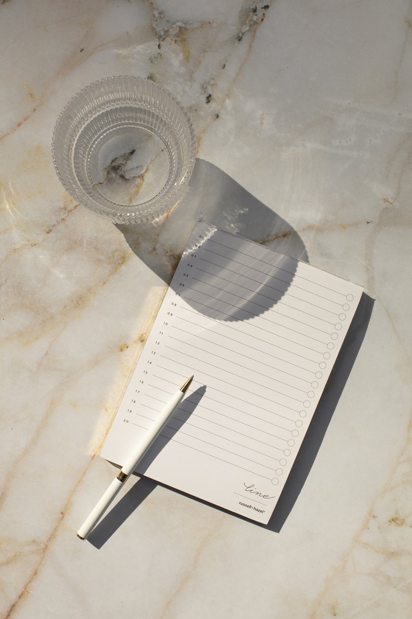 An open notebook and pen on a clean surface